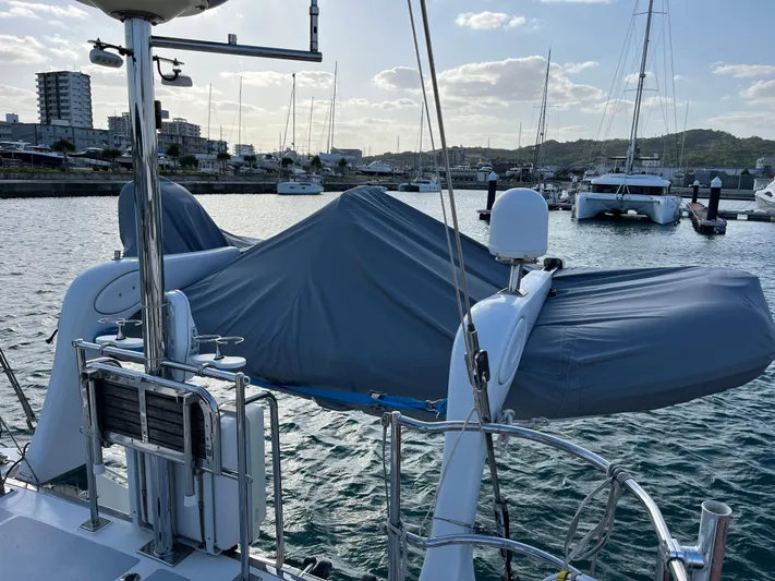 Voodoo Yacht Photos Pics Sailboat docked in marina, Hylas 70 model, 2010, with covered equipment on deck.