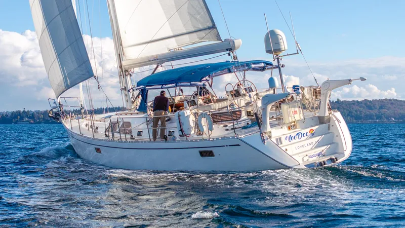 Voodoo Yacht Photos Pics Sailing yacht Hylas 70, 2010 model, cruising on open water with sails unfurled.