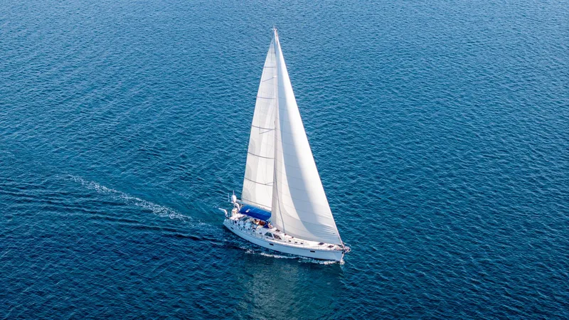 Voodoo Yacht Photos Pics Sailing yacht Hylas 70, 2010 model, gliding on open blue sea.