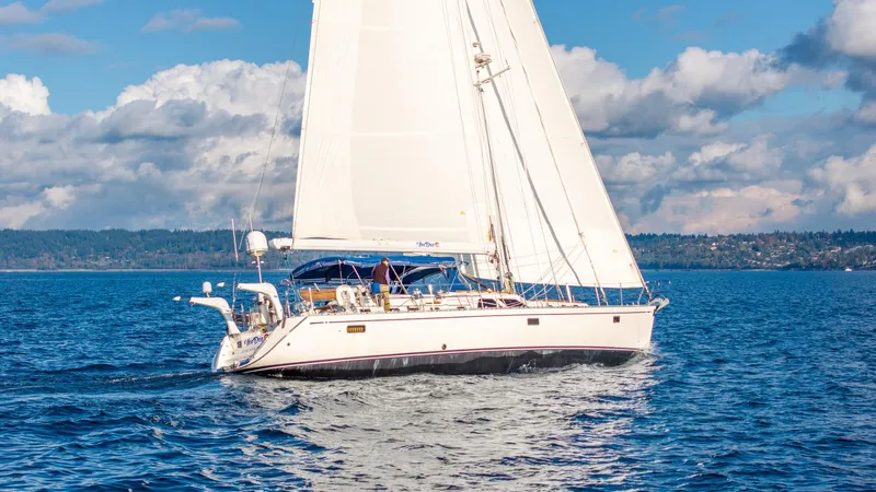 Voodoo Yacht Photos Pics Sailing yacht Hylas 70, 2010 model, cruising on open water under a clear sky.