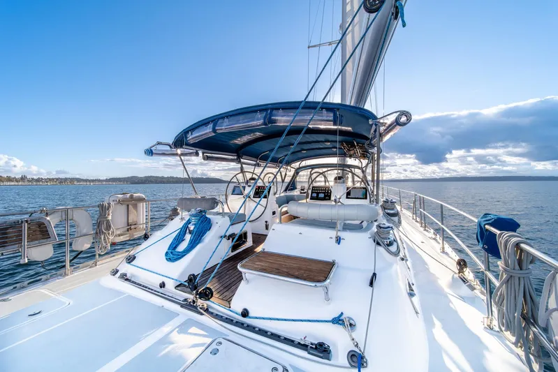 Voodoo Yacht Photos Pics Sailing yacht Hylas 70, 2010 model, on open water under clear blue sky.