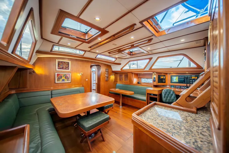 Voodoo Yacht Photos Pics Luxurious interior of 2010 Hylas 70 yacht with wood finish and skylights.