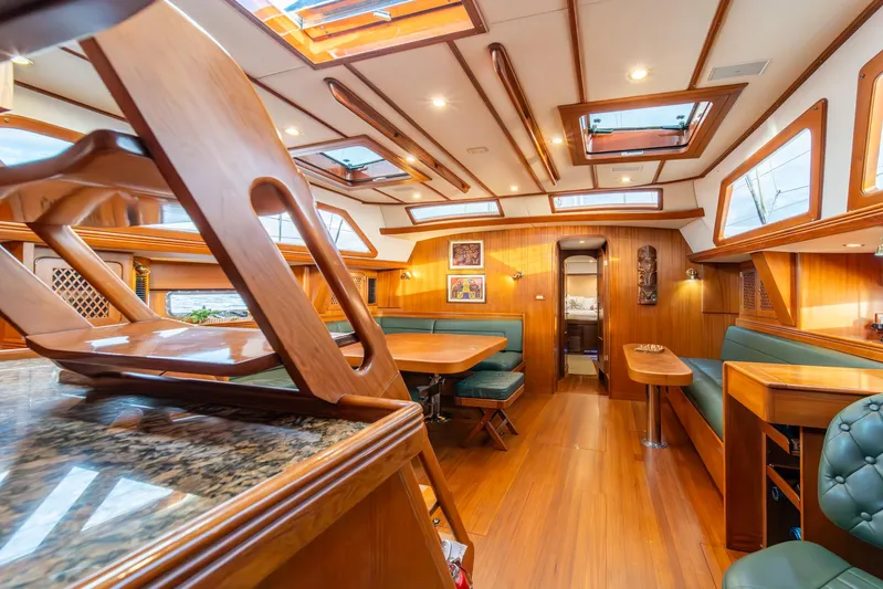 Voodoo Yacht Photos Pics Luxurious interior of a 2010 Hylas 70 yacht with wood finishes and skylights.