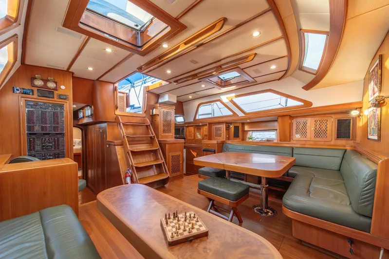 Voodoo Yacht Photos Pics Luxurious interior of a 2010 Hylas 70 yacht with wood finishes and skylights.