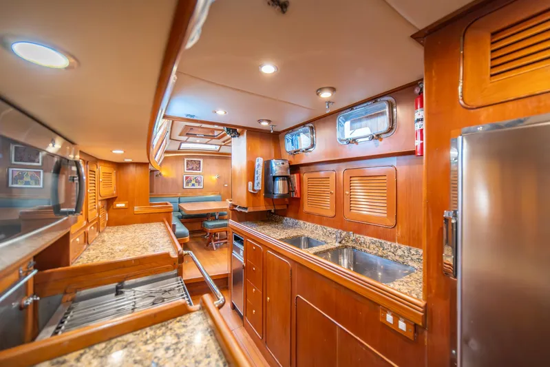 Voodoo Yacht Photos Pics Luxurious interior of 2010 Hylas 70 yacht with wood finish and modern amenities.