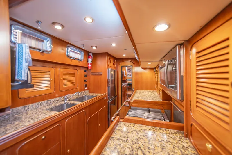 Voodoo Yacht Photos Pics Luxurious Hylas 70 yacht kitchen with granite countertops and wooden cabinetry, 2010 model.