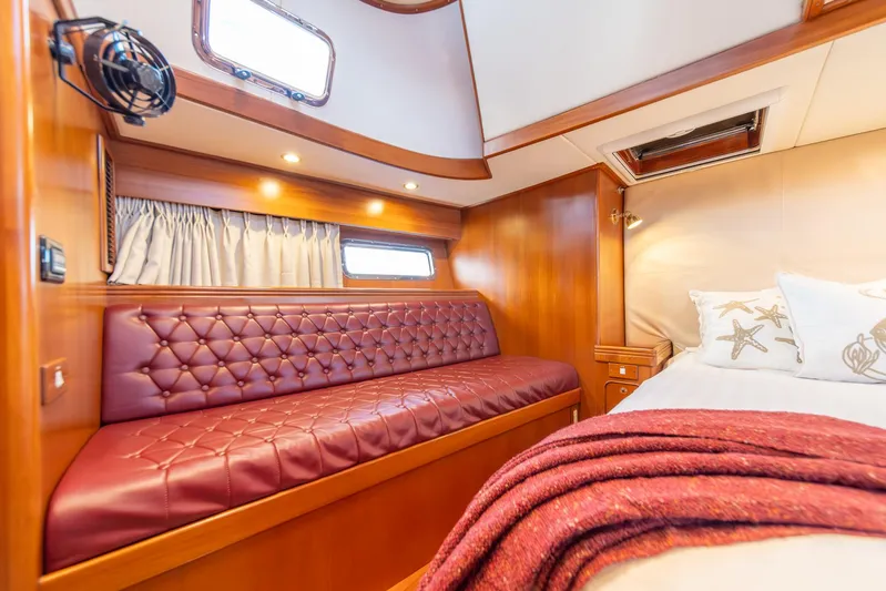 Voodoo Yacht Photos Pics Luxurious cabin interior of a 2010 Hylas 70 yacht with elegant wood finish.
