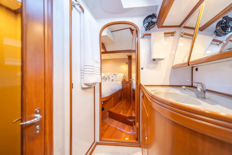 Voodoo Yacht Photos Pics Luxurious interior of 2010 Hylas 70 yacht featuring wood finishes and elegant design.