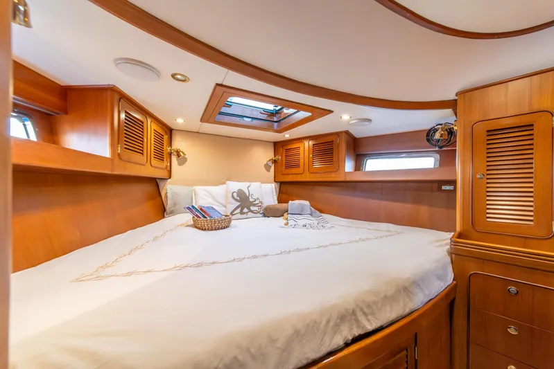 Voodoo Yacht Photos Pics Luxurious cabin interior of 2010 Hylas 70 yacht with wood finish and skylight.