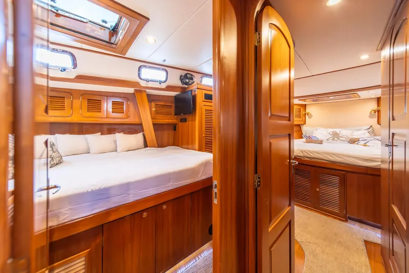 Voodoo Yacht Photos Pics Luxurious interior of 2010 Hylas 70 yacht with wooden finish and cozy bedrooms.