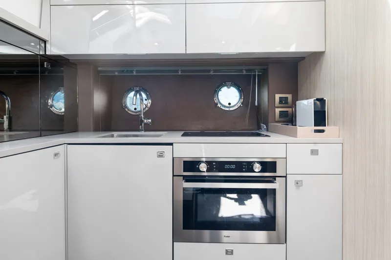 Damare Yacht Photos Pics Modern kitchen interior of 2022 Cranchi M 44 HT yacht with sleek appliances.
