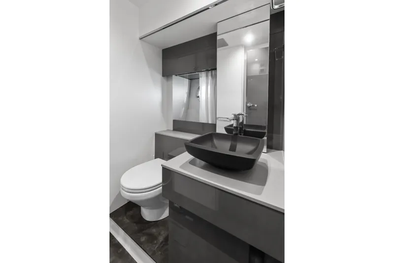 Damare Yacht Photos Pics Modern bathroom in 2022 Cranchi M 44 HT yacht with sleek fixtures and elegant design.