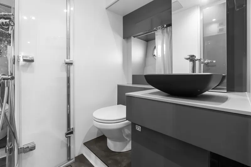 Damare Yacht Photos Pics Modern bathroom interior on 2022 Cranchi M 44 HT yacht, featuring sleek fixtures and elegant design.
