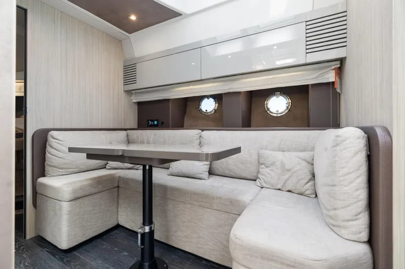 Damare Yacht Photos Pics 2022 Cranchi M 44 HT yacht interior with modern seating and table.