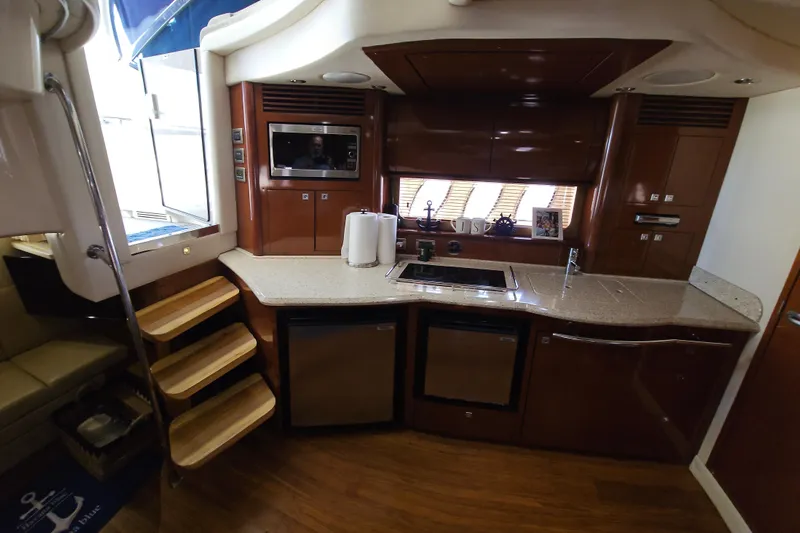  Yacht Photos Pics Luxurious kitchen interior of 2008 Sea Ray 40 Sundancer yacht with modern amenities.