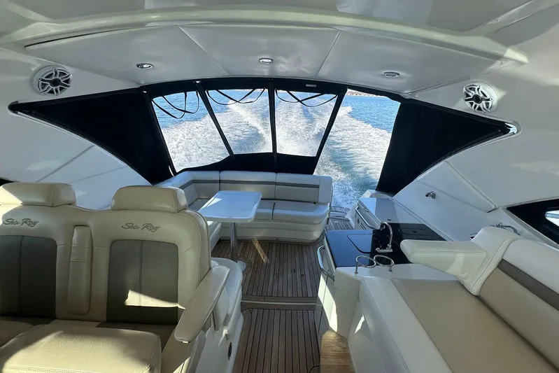  Yacht Photos Pics Luxurious interior of 2014 Sea Ray 410 Sundancer yacht with elegant seating and ocean view.