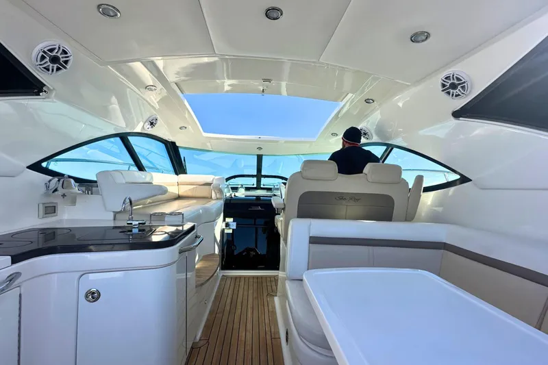  Yacht Photos Pics Interior of 2014 Sea Ray 410 Sundancer yacht with modern seating and navigation area.