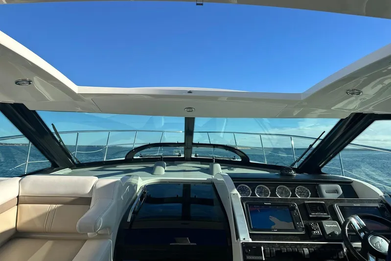  Yacht Photos Pics Interior view of 2014 Sea Ray 410 Sundancer yacht cockpit with ocean backdrop.