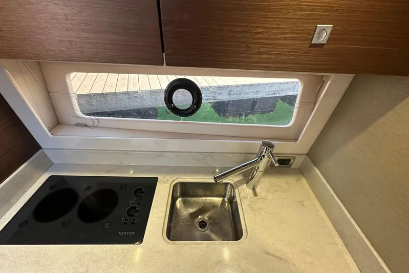  Yacht Photos Pics Modern kitchen area in 2014 Sea Ray 410 Sundancer yacht with sink and stove.