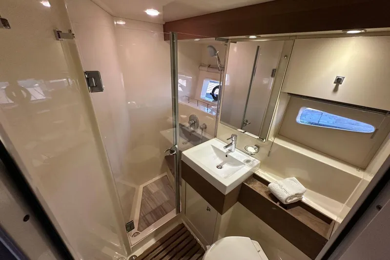 Yacht Photos Pics Luxurious bathroom interior of 2014 Sea Ray 410 Sundancer yacht with modern fixtures.
