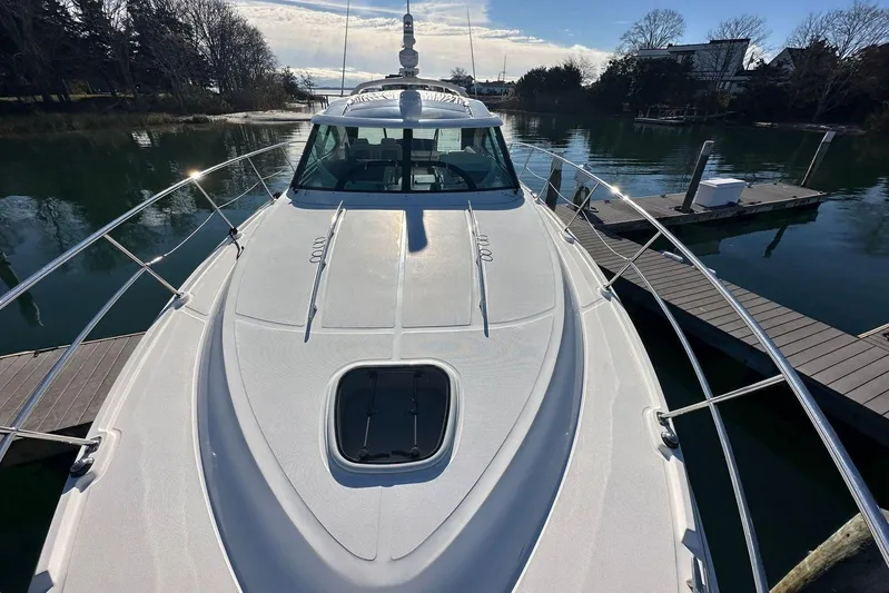  Yacht Photos Pics 2014 Sea Ray 410 Sundancer yacht docked in a serene marina setting.