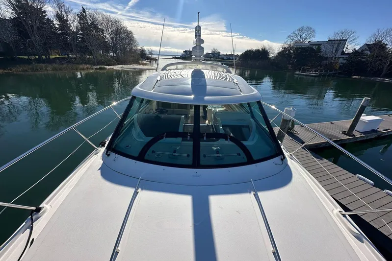  Yacht Photos Pics 2014 Sea Ray 410 Sundancer yacht docked in a serene marina setting.