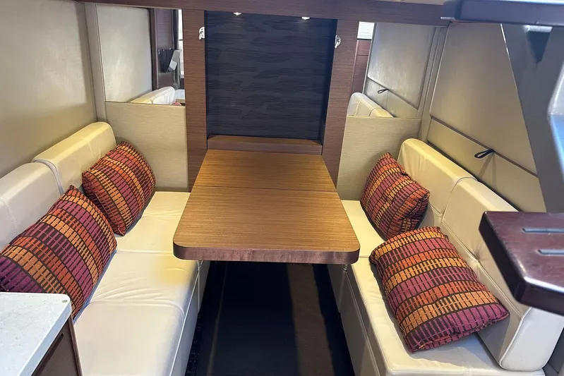  Yacht Photos Pics 2014 Sea Ray 410 Sundancer interior with cozy seating and vibrant cushions.