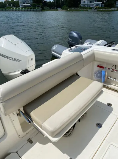 Patriot Yacht Photos Pics 2020 Boston Whaler 250 R boat with Mercury engine, beige seating, and water view.