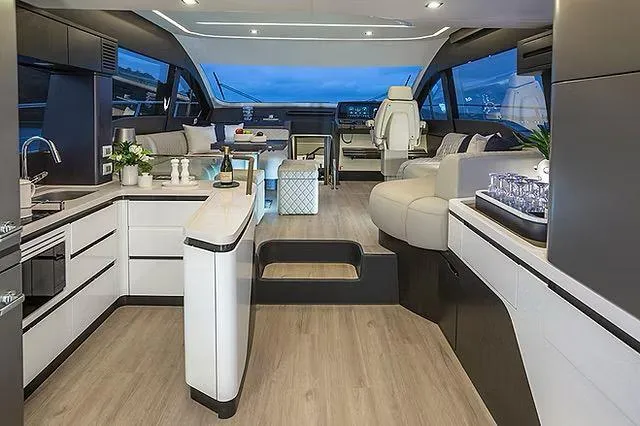  Yacht Photos Pics Luxurious interior of 2026 Schaefer 600 yacht with modern kitchen and seating area.