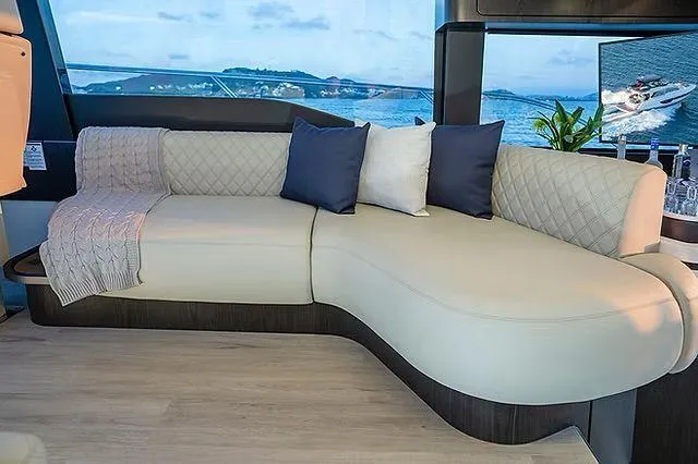  Yacht Photos Pics Luxurious Schaefer 600 yacht interior with elegant beige sofa and scenic ocean view, 2026 model.