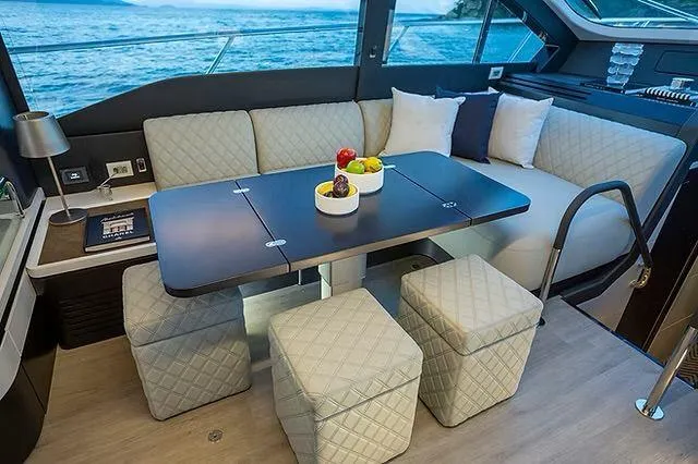  Yacht Photos Pics Luxurious interior of 2026 Schaefer 600 yacht with elegant seating and ocean view.