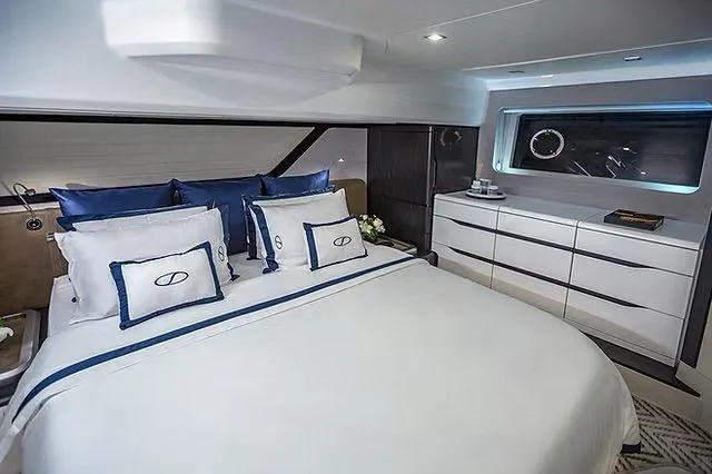  Yacht Photos Pics Luxurious cabin interior of 2026 Schaefer 600 yacht with elegant bedding and modern furnishings.