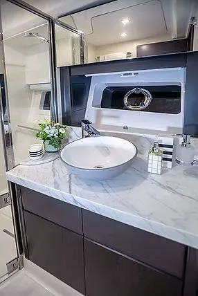  Yacht Photos Pics Luxurious Schaefer 600 yacht bathroom with marble countertop and modern fixtures, 2026 model.