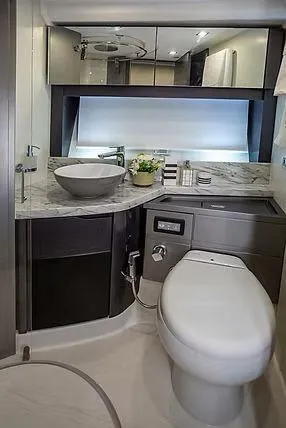  Yacht Photos Pics Luxurious bathroom in 2026 Schaefer 600 yacht with modern fixtures and elegant design.
