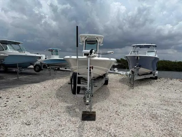 Caymas 28 Hb Twin Yacht Photos Pics 2022 Caymas 28 Twin boat on trailer, surrounded by other boats, under cloudy sky.