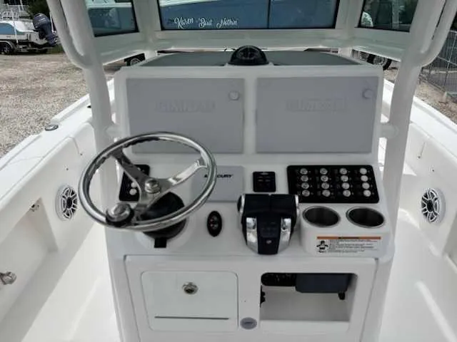 Caymas 28 Hb Twin Yacht Photos Pics 2022 Caymas 28 Twin boat console with steering wheel and control panel.