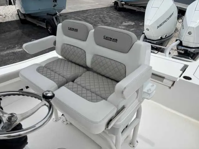 Caymas 28 Hb Twin Yacht Photos Pics 2022 Caymas 28 Twin boat seating with dual Mercury engines in the background.