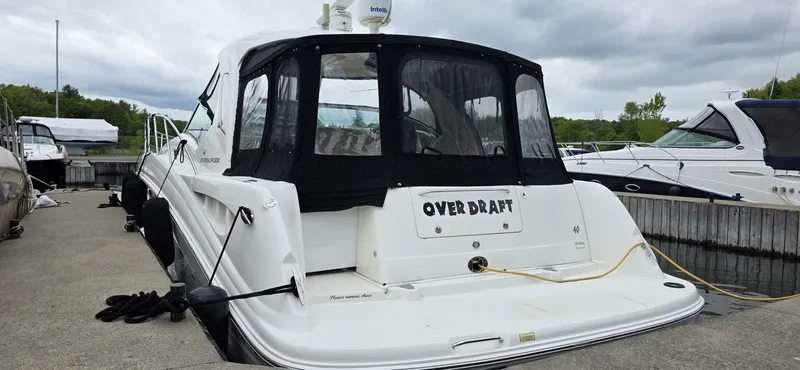  Yacht Photos Pics 2005 Sea Ray 40 Sundancer docked, rear view with "Over Draft" name visible.