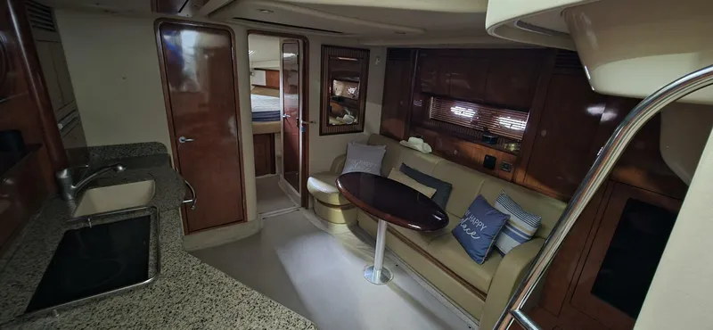  Yacht Photos Pics Interior of 2005 Sea Ray 40 Sundancer yacht with kitchen and seating area.