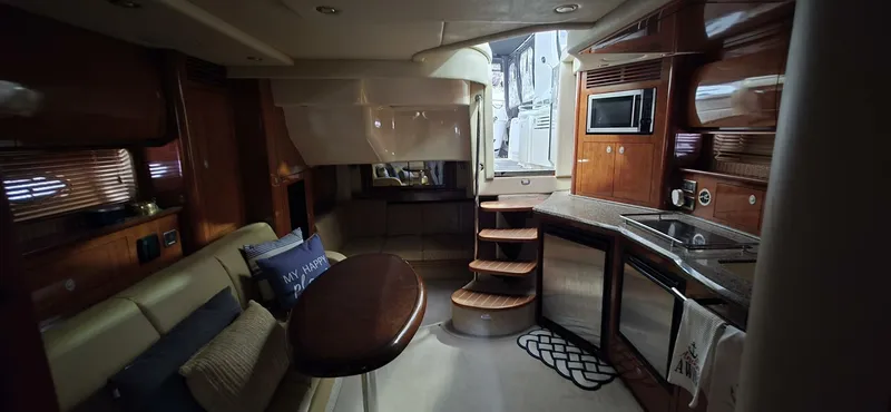  Yacht Photos Pics Interior of 2005 Sea Ray 40 Sundancer yacht with kitchen and seating area.