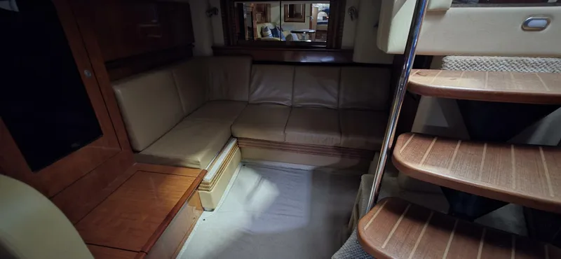  Yacht Photos Pics Interior of 2005 Sea Ray 40 Sundancer with leather seating and wooden stairs.