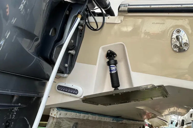  Yacht Photos Pics 2013 Grady-White Freedom 335 boat stern with motor and hydraulic components.