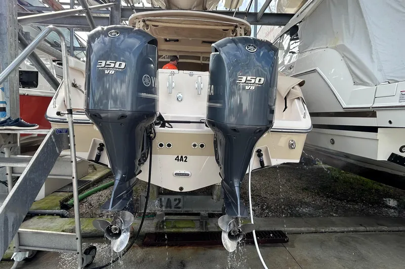 Yacht Photos Pics 2013 Grady-White Freedom 335 with twin Yamaha 350 V8 outboard engines in a marina.