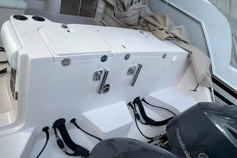  Yacht Photos Pics 2013 Grady-White Freedom 335 boat interior with dual engines and storage compartments.