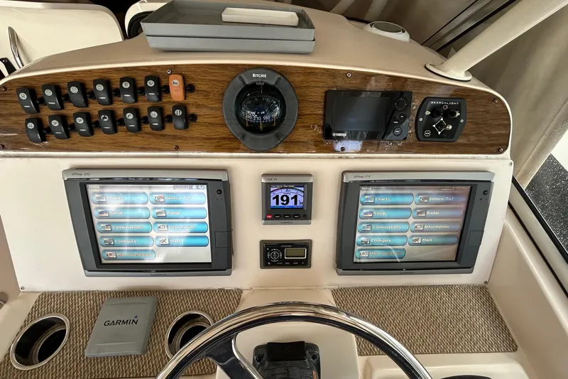  Yacht Photos Pics Control panel of 2013 Grady-White Freedom 335 boat with navigation screens and instruments.