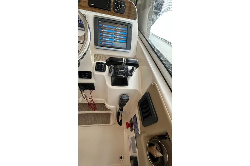  Yacht Photos Pics 2013 Grady-White Freedom 335 boat dashboard with touchscreen and controls.