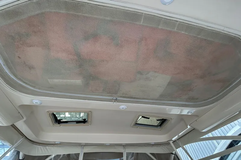  Yacht Photos Pics Interior view of 2013 Grady-White Freedom 335 boat ceiling with hatches and netting.