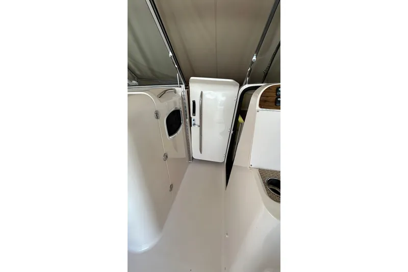  Yacht Photos Pics 2013 Grady-White Freedom 335 boat interior with open door and sleek design.