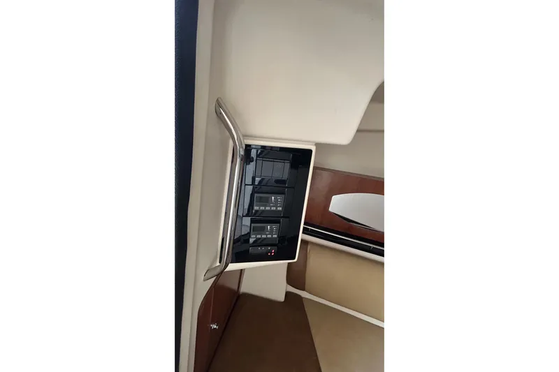  Yacht Photos Pics 2013 Grady-White Freedom 335 interior with control panel and seating area.