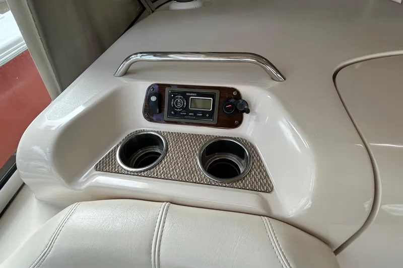  Yacht Photos Pics 2013 Grady-White Freedom 335 boat console with cup holders and Kenwood audio system.